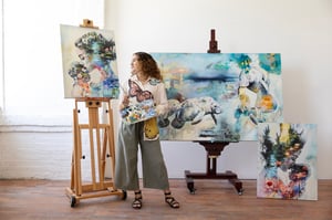 Woman Standing in front of romanic paintings blue green gray